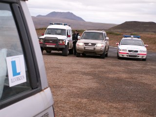 Three cop cars