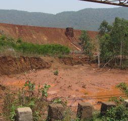 Scar left by red mud spill.