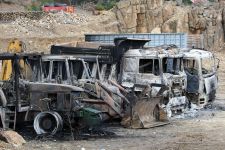 Burned vehicles are seen at the ‘Hellas Gold’ mining company’s facility in the village of Skouries
